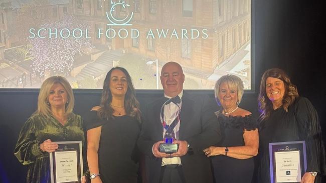 Catering and Facilities Management (FM) team collecting award Catering and Facilities Management (FM) team collecting award